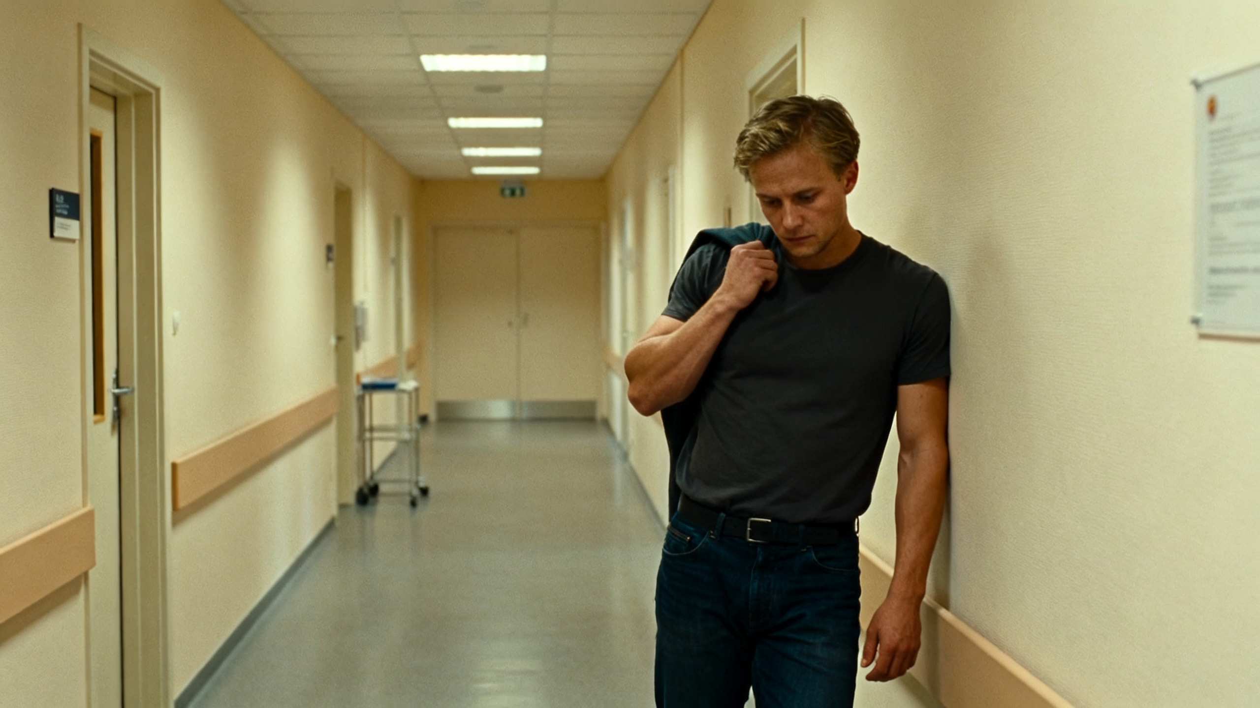 Young man in a clinic hallway weighing a risky treatment decision