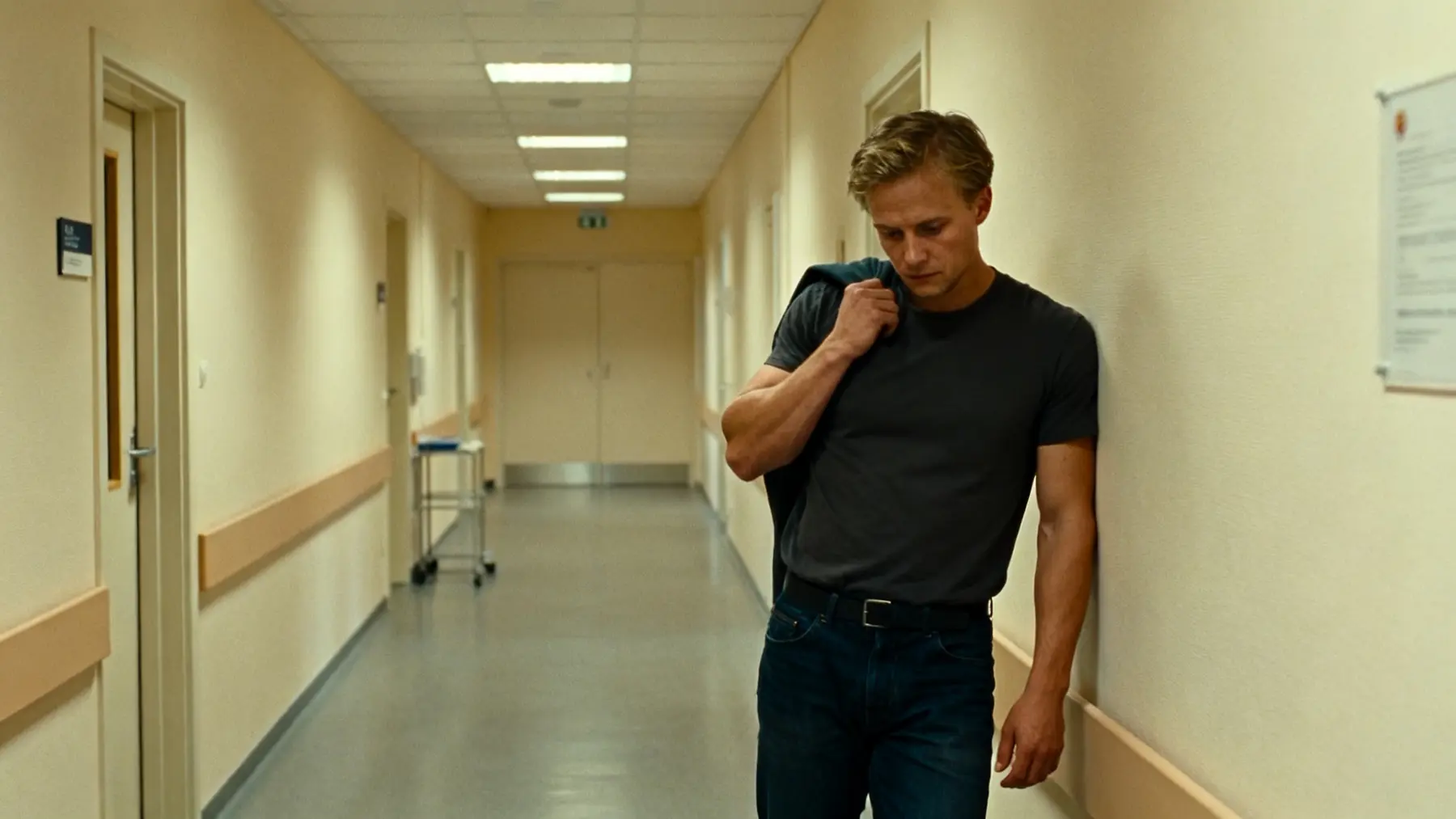 Young man in a clinic hallway weighing a risky treatment decision