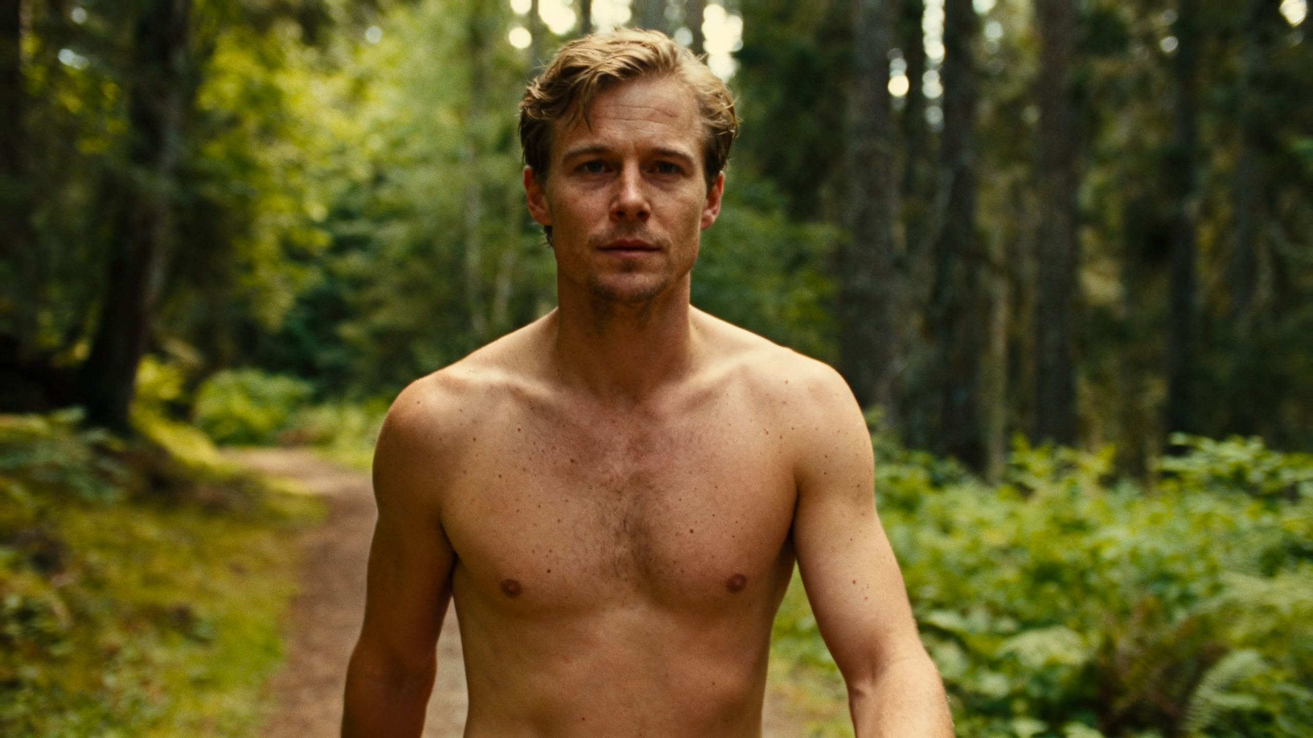 Man walking calmly on a forest trail after facing anxiety