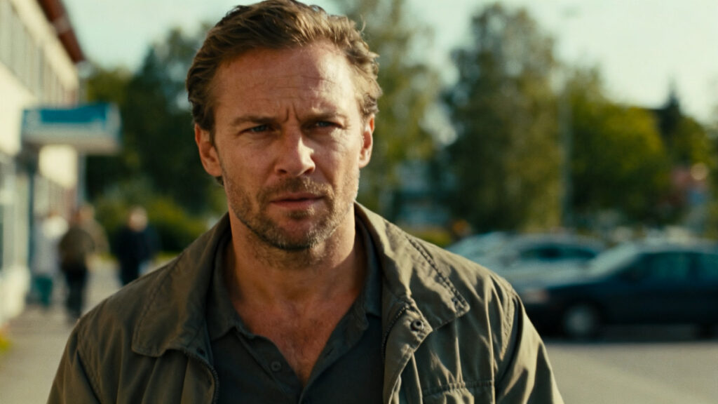 A man walking outside after a clinic visit.