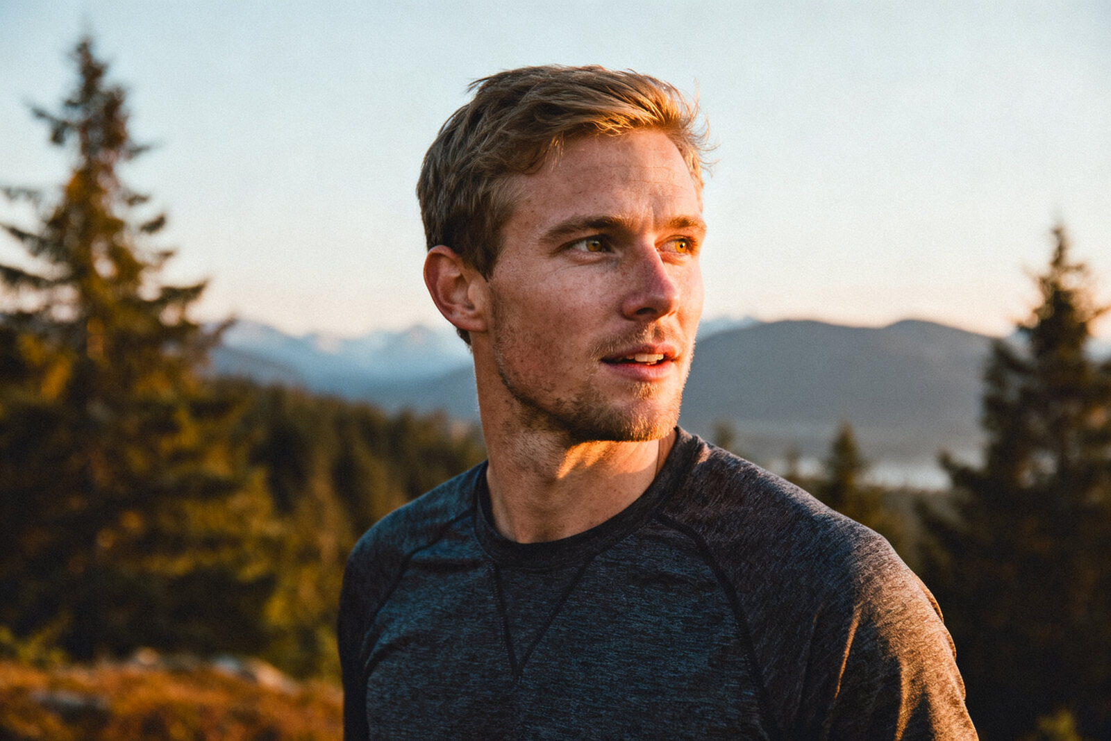 Fit man outdoors in morning light, active and relaxed, Pacific Northwest landscape