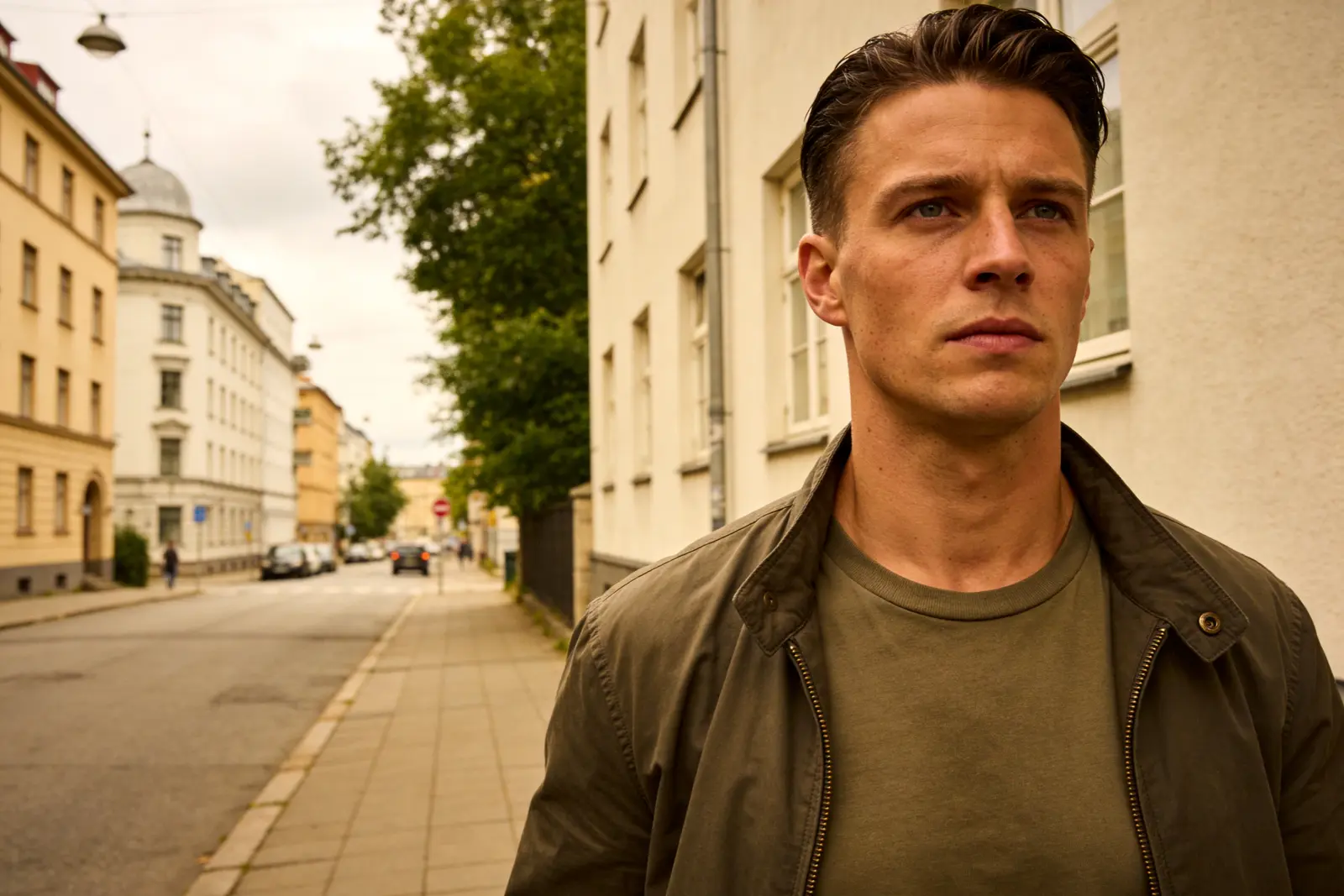 Man walking forward on a city street, composed and deliberate