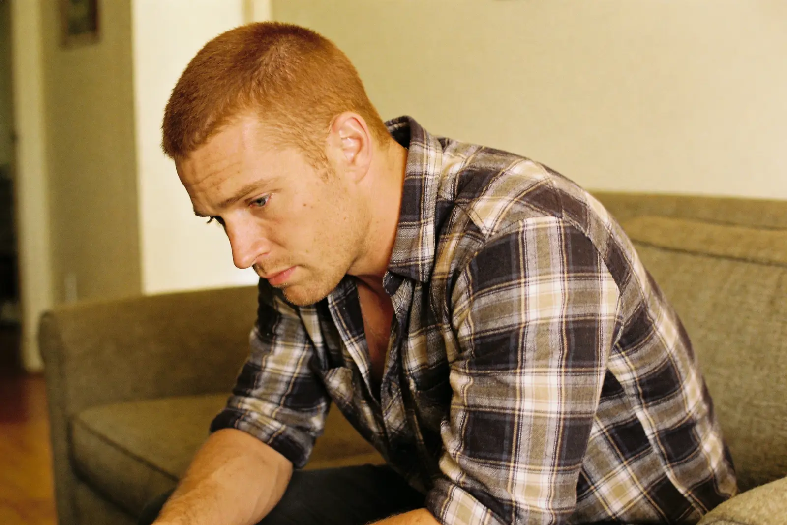 Man sitting alone in thought, weighing something honestly with himself