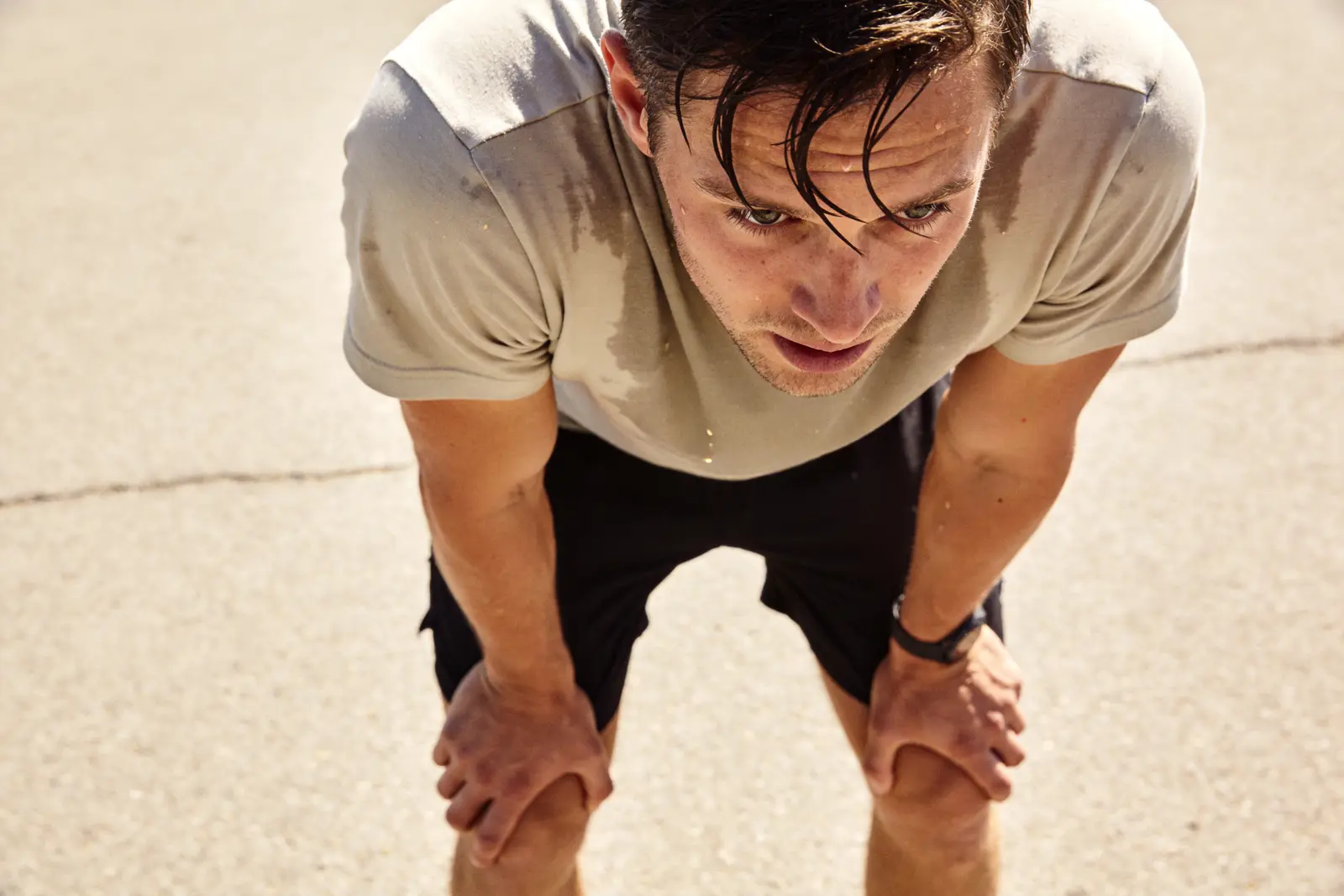Man mid-workout catching his breath, heart rate up